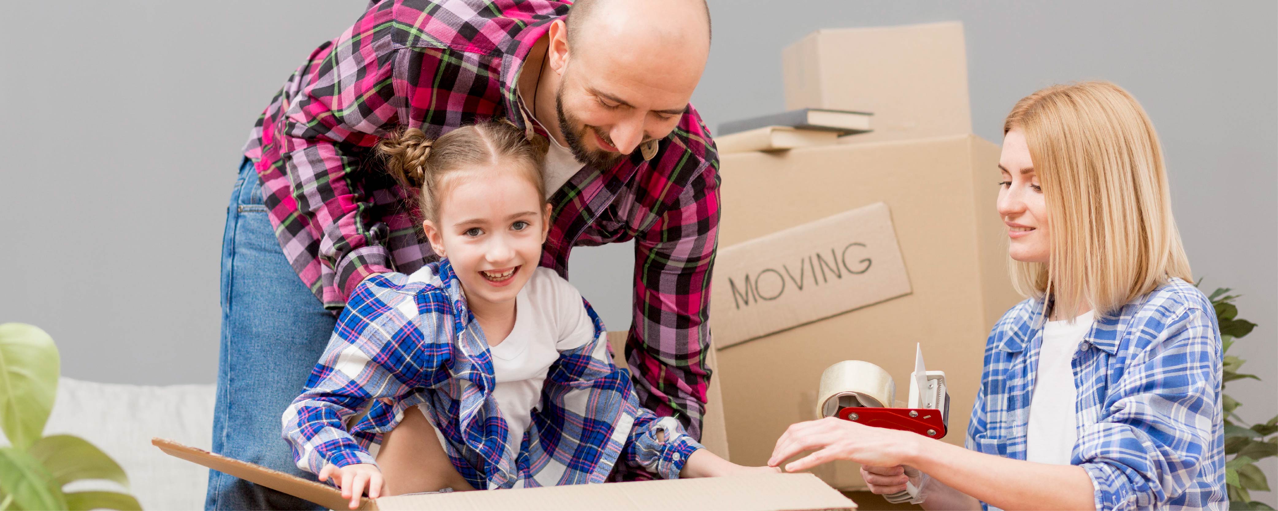 A family packing boxes to move to Scotland